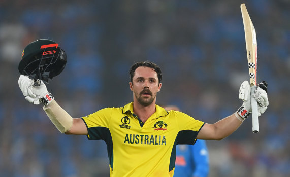 Travis Head celebrates his century in the World Cup final.