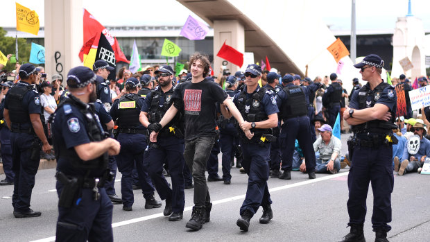 Police arrest Extinction Rebellion activists on the William Jolly Bridge on October 11.