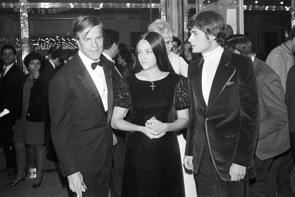 Romeo and Juliet director Franco Zeffirelli, left, actors Olivia Hussey, centre, and Leonard Whiting are seen after the Parisian premiere of the film in 1968. 