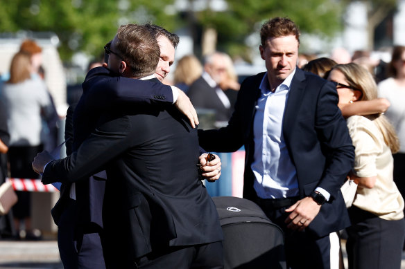Patrick Dangerfield and Scott Selwood embrace.