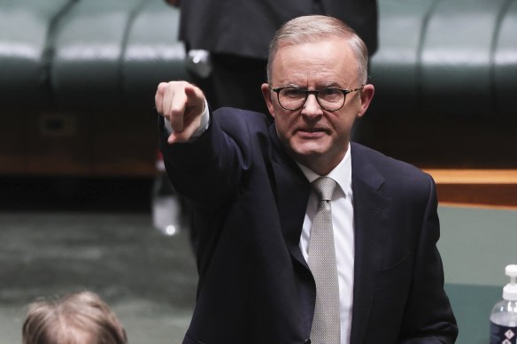 Anthony Albanese points to a member of the parliamentary gallery after his budget-in-reply speech.