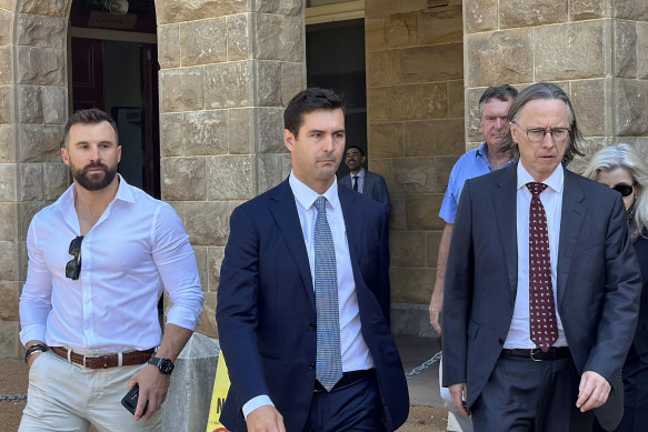 Cameron Waugh (centre) leaving leaving court.