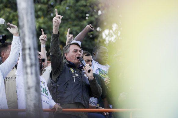 Bolsonaro talks to supporters after the rally. 
