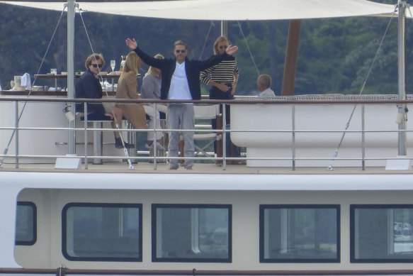 Murdoch on his yacht, Istros, in Sydney Harbour in June this year, seemingly  annoyed at the attention of the paparazzi.