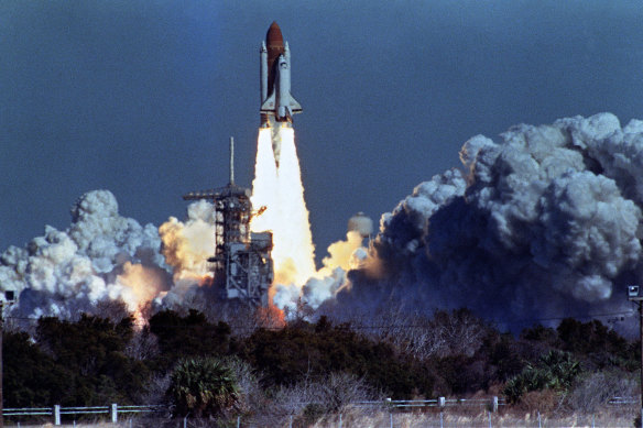 US space shuttle Challenger lifts off 28 January 1986 from a launch pad at Kennedy Space Center.