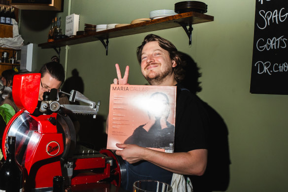 Al Robertson, owner of Hobart wine bar Sonny, with an LP he bought from the store.