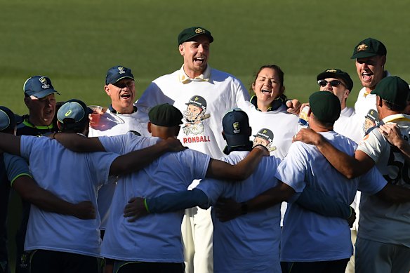 The Australians toast their victory in their new T-shirts, courtesy of Travis Head.