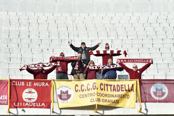 A group of Cittadella fans celebrate an away win over Ascoli in January 2018.