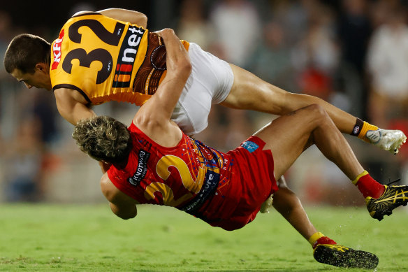 In his grasp: Hawthorn’s Finn Maginness is tackled by Izak Rankine.