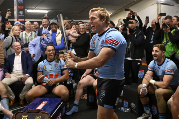 Jake Trbojevic wields Michael Maguire’s famous baseball bat after NSW’s State of Origin series win.
