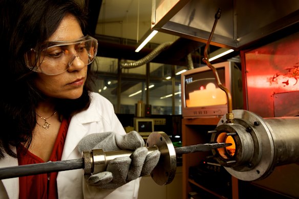 Professor Veena Sahajwalla at a laboratory furnace at the UNSW SMaRT Centre.
