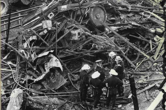 Rescuers comb the wreckage of the fire at Luna Park which claimed the lives of seven people in 1979.