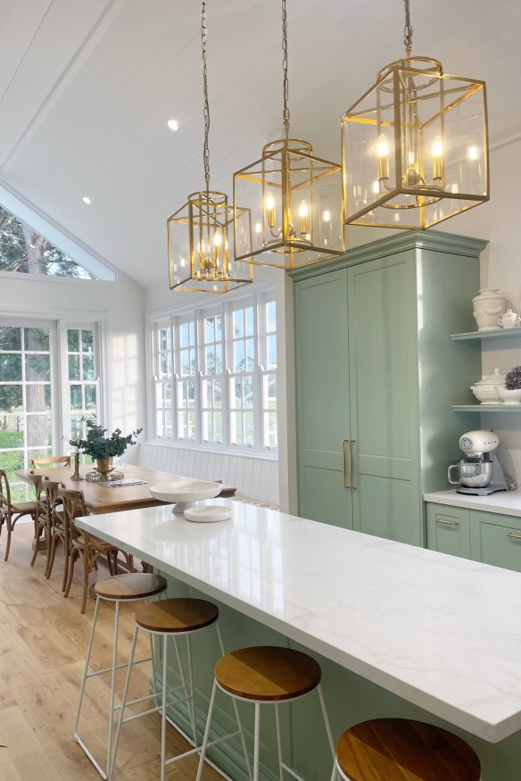 The kitchen area’s vast windows bring in the bucolic surrounds.