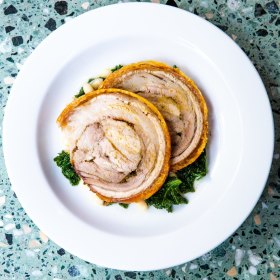 Porchetta with kale and white beans. 