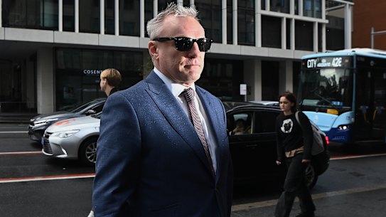 NRL journalist Paul Kent walks into Downing Centre Local Court on Wednesday to fight domestic violence charges after he allegedly attacked a 33-year-old woman.