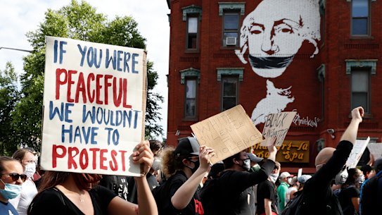 Demonstrators march to protest the death of George Floyd in Washington. 