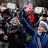 Hundreds of demonstrators gather on Cambridge Common during a rally at the historic park in Cambridge, Mass Massachussetts on Saturday calling on Harvard University to resist what organisers described as attempts by President Donald Trump to influence the institution.