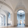 Brooklyn Museum’s Beaux-Arts Court features a large brass chandelier.