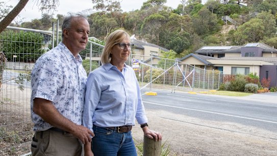 Gerry and Bronwyn Borghesi at the bottom of the hill where a landslide destroyed the home below theirs.