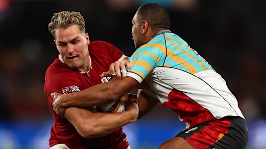MELBOURNE, AUSTRALIA - JULY 22: Duhan van der Merwe of the British and Irish Lions (L) is tackled by Kurtley Beale of the First Nations & Pasifika during the tour match between First Nations & Pasifika v British & Irish Lions at Marvel Stadium on July 22, 2025 in Melbourne, Australia. (Photo by Graham Denholm/Getty Images)