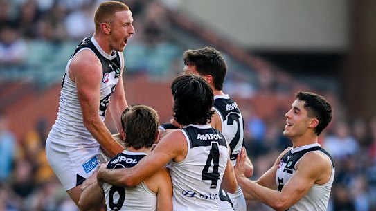 ADELAIDE, AUSTRALIA - APRIL 06:   Matthew Kennedy of the Blues  celebrates the last goal of the match with  his team mates during the round four AFL match between Fremantle Dockers and Carlton Blues at Adelaide Oval, on April 06, 2024, in Adelaide, Australia. (Photo by Mark Brake/Getty Images)