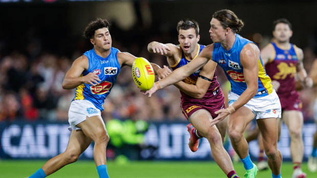AFL 2024 round eight LIVE updates: Injury carnage for Lions, who lead Suns in QClash; Hawks stun Bulldogs for upset win