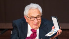 Henry Kissinger, former US secretary of state, holds the Bavarian Order of Maximilian during celebrations marking his 100th birthday.