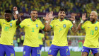 Brazil teammates celebrate after their second goal.