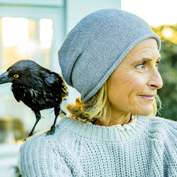 Sam Bloom with Frankie the currawong, one of the family’s current feathered friends.