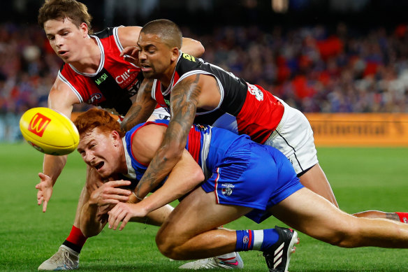 Mattaes Phillipou and Brad Hill exemplify St Kilda’s intensity with a gang-tackle on Ed Richards.