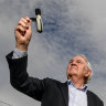 John and Susan Jennison look at a noise level monitor at their Keilor home.