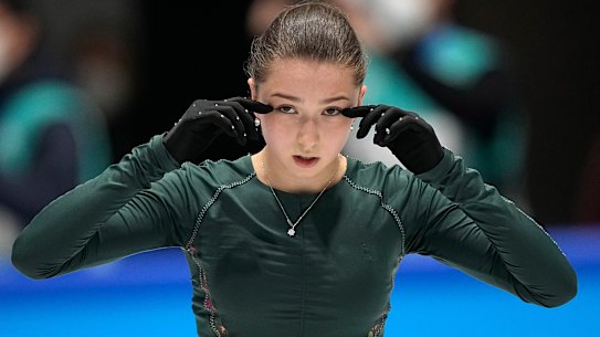Kamila Valieva, of the Russian Olympic Committee, wipes her eyes during a training session at the Winter Olympics in Beijing.