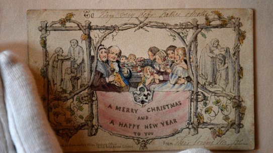 The world's first printed Christmas card is displayed at the Dickens House Museum in London. The hand coloured lithograph card was produced in 1843 and sold for one shilling.