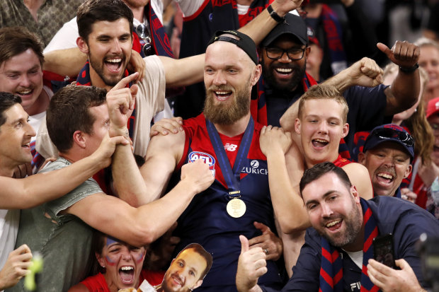 Gawn celebrates with fans after Melbourne’s 2021 AFL grand final victory. 