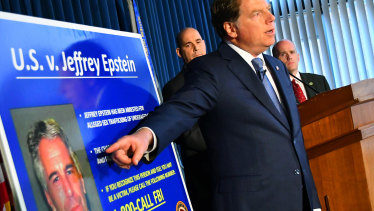 Geoffrey Berman, US attorney for the Southern District of New York, details the new charges, while standing next to a poster displaying the image of fund manager Jeffrey Epstein last week.