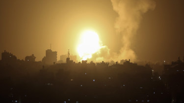 An explosion is caused by Israeli airstrikes on a Hamas military base in town of Khan Younis, southern Gaza Strip, on Tuesday.