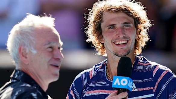 Alexander Zverev talks to John McEnroe after his semi-final win.