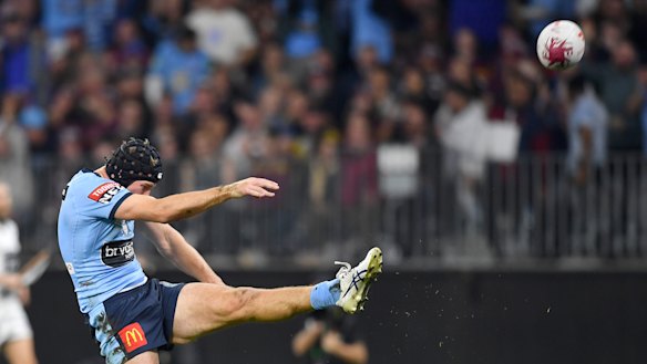 Matt Burton puts up a bomb during game two in Perth.