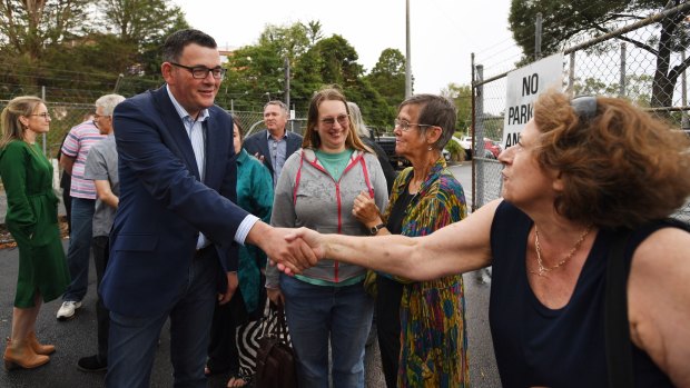 Victorian Premier Daniel Andrews is greeted by locals after announcing plans to expand parking facilities at Belgrave train station.