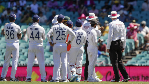 Paul Reiffel and Paul Wilson speak to the Indian players before tea.