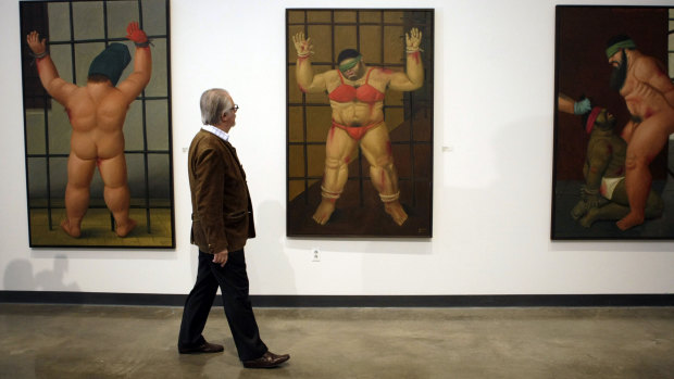 Colombian artist Fernando Botero looks over his paintings and drawings on Abu Ghraib prison at American University Museum in Washington in 2007. Botero died on September 15, age 91.
