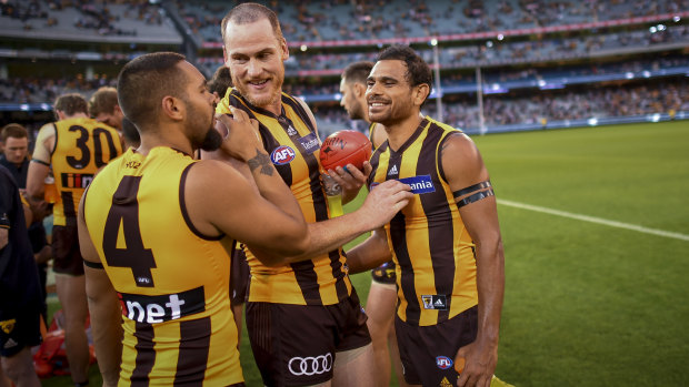 Jarman Impey, Jarryd Roughead and Cyril Rioli savour the win.