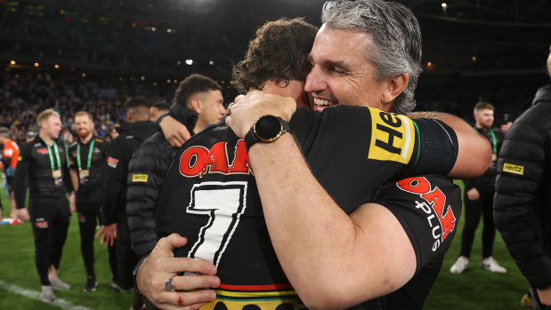 Panthers coach Ivan Cleary hugs son Nathan after Penrith won their second straight title.