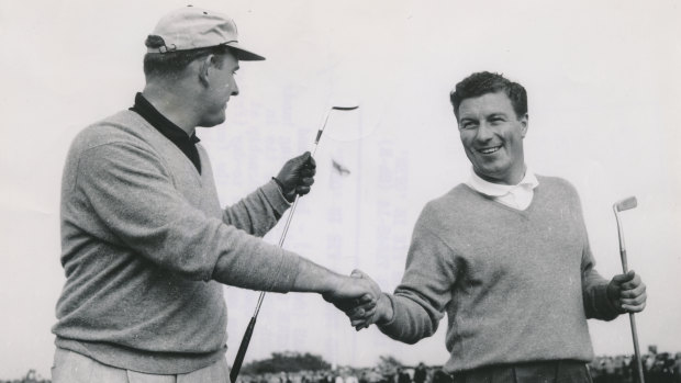 Peter Thomson, holding the hickory putter, celebrates victory in the British Open in 1958.