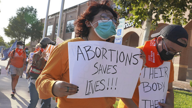 Abortion rights supporters gather to protest the Texas abortion law in front of Edinburg City Hall in Edinburg, Texas.