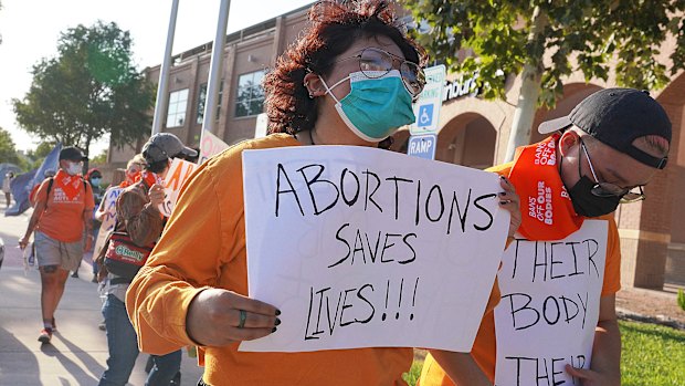 Abortion rights supporters gather to protest the Texas abortion law in front of Edinburg City Hall in Edinburg, Texas.