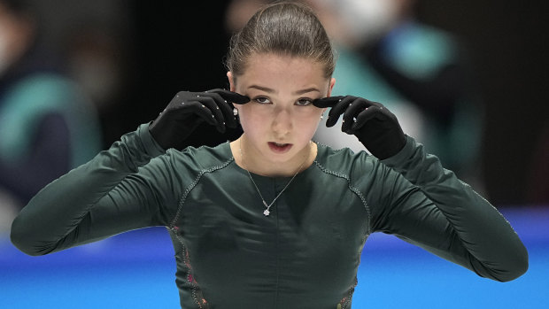 Kamila Valieva, of the Russian Olympic Committee, wipes her eyes during a training session at the Winter Olympics in Beijing.