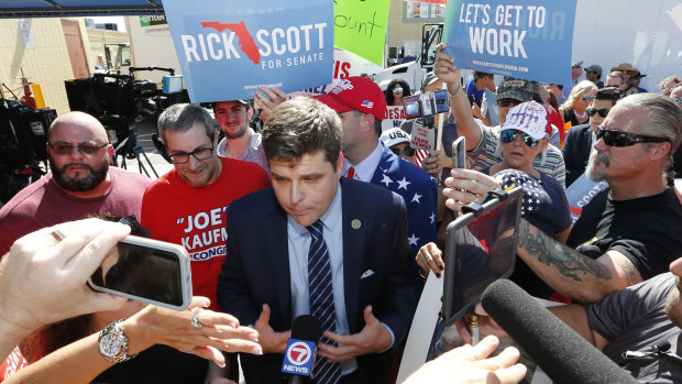 US Representative Matt Gates speaks with the media during a protest at the Broward County Supervisor of Elections office on Friday.