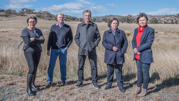 Googong residents who are opposing a cemetery being built at the Old Cooma Road site (from left) Beth and Geoff Smith, Brian and Joanna Hartfield and Wendy Hubbard. 
