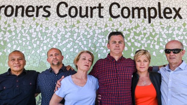The parents of young people who died at music festivals embrace outside the NSW Coroners Court.